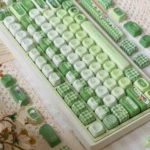 Whimsical Matcha Totoro PBT keycap set for keyboards, featuring cute Totoro characters and calming matcha green tones from multiple angles.