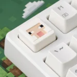 A collection of handcrafted Minecraft animal resin keycaps, showcasing their charming pixelated designs and vibrant colors from various playful angles.