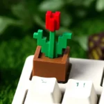 Multiple angles of the playful Minecraft Tulip artisan keycap, showcasing its vibrant pixel art and nature-inspired design for a unique keyboard.