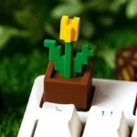 A vibrant pixelated Minecraft Tulip artisan keycap displayed from multiple playful angles, highlighting its iconic, nature-inspired design for your choice.