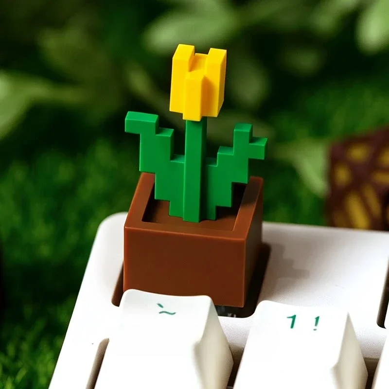 A vibrant pixelated Minecraft Tulip artisan keycap displayed from multiple playful angles, highlighting its iconic, nature-inspired design for your choice.