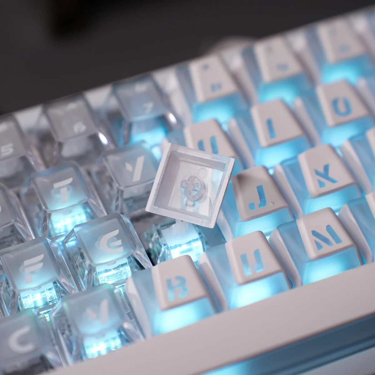 Vibrant Minimalist Prism Cherry Keycaps, multiple angles reveal crisp luminous legends, modern aesthetic, and dazzling light refraction.