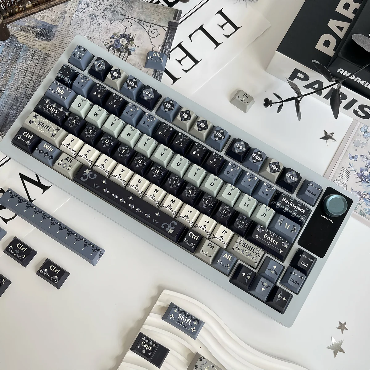 A close-up view of the Romantic Night Weaving PBT Dye-sub Keycap Set, showcasing its dark, enchanting celestial patterns from a unique angle, perfect finish.