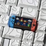 Iconic Nintendo Switch Series Super Mario keycap gallery, showing its playful miniature console design from different angles with translucent details for gaming keyboard.