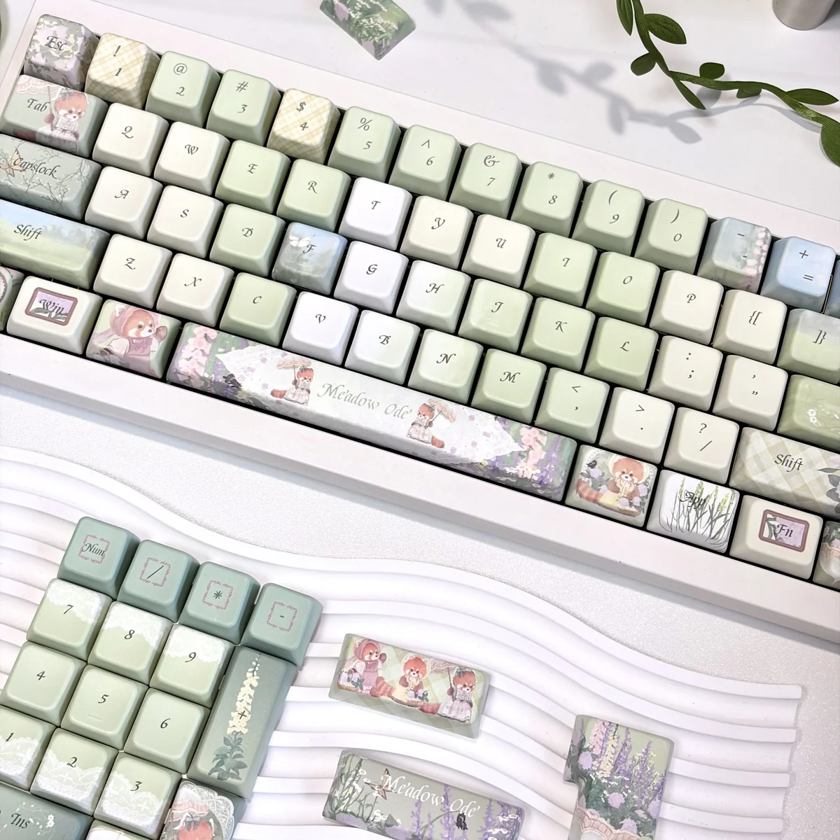 Meadow Ode Luminous Side-Lit PBT keycap set, displayed from various angles, highlighting its tranquil nature-inspired designs and soft luminous glow.