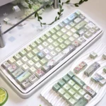 An artistic close-up of the Meadow Ode Luminous PBT Keycap Set, highlighting the unique side-lit legends and tranquil, nature-inspired design.