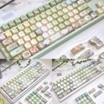 Meadow Ode Luminous Side-Lit PBT Keycap Set. Artisanal nature-inspired designs glow softly, highlighting refined textures and unique craftsmanship.