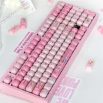 Close-up of a set of playful pig gummy MOG keycaps for MX keyboards, showcasing their sweet pastel colors and unique rounded profile from multiple angles.
