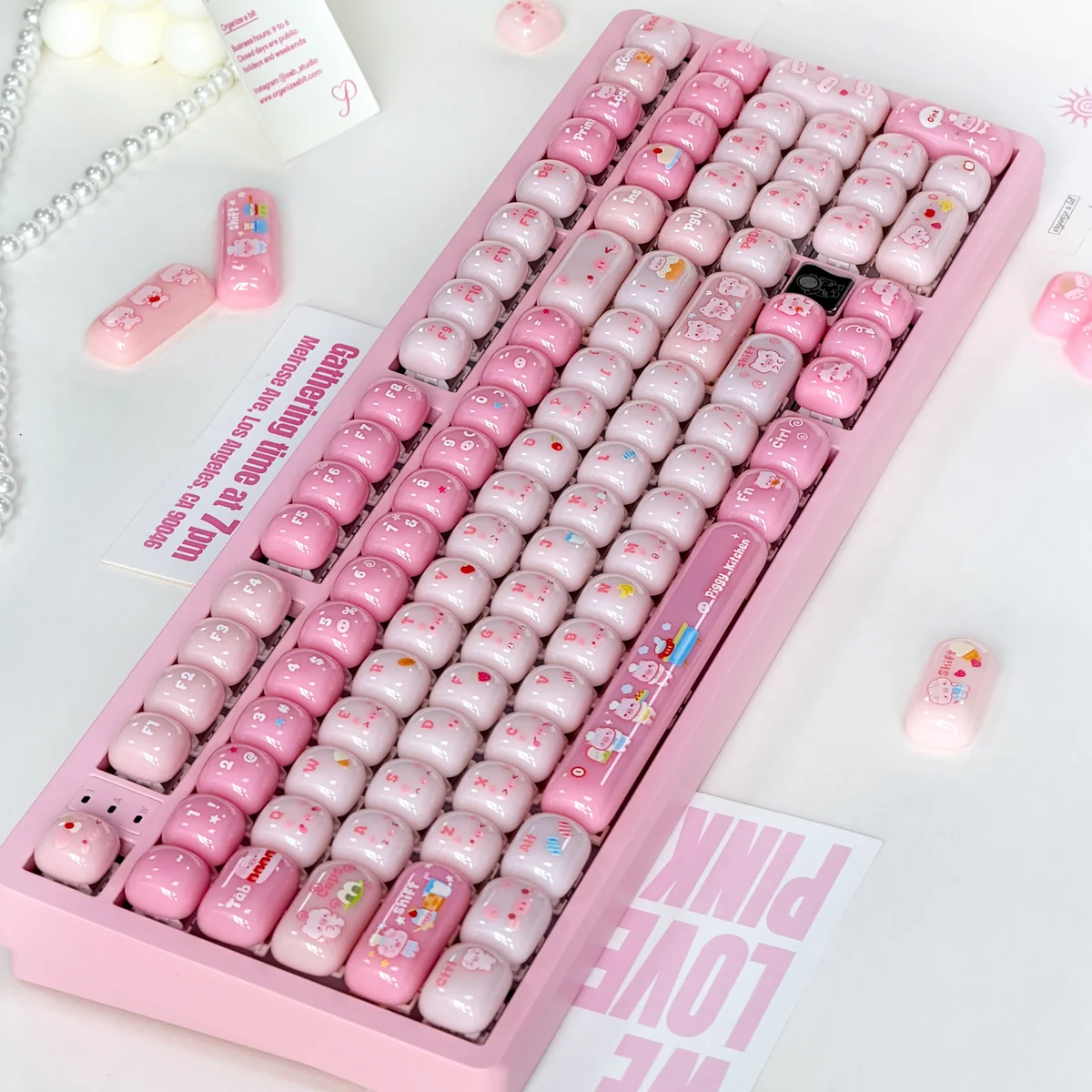 Close-up of a set of playful pig gummy MOG keycaps for MX keyboards, showcasing their sweet pastel colors and unique rounded profile from multiple angles.