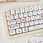 Adorable Pink Bear MOA Profile keycaps set presented from various angles, highlighting their unique smooth jade-like texture and soft pink hues.