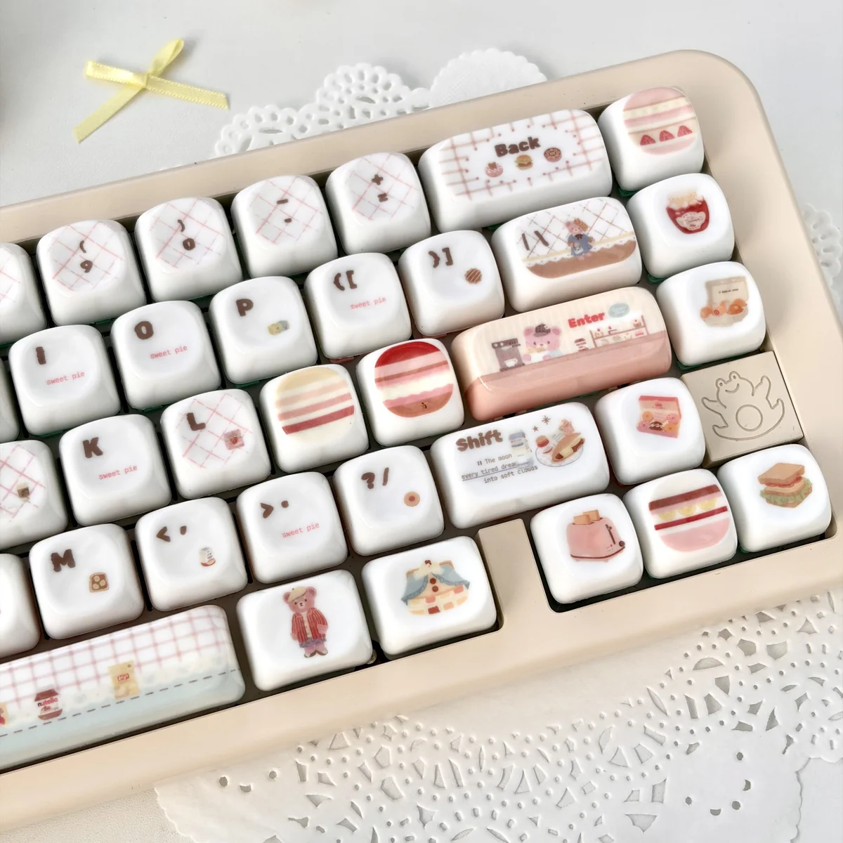 Close-up views of adorable pink bear MOA profile keycaps set, highlighting their unique smooth jade-like texture and charming design from multiple angles.