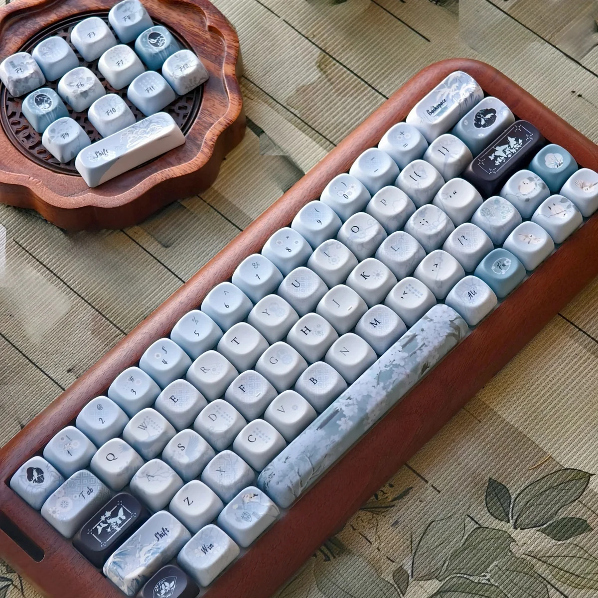 Handcrafted Plum Blossom Frost PBT keycaps, displaying serene traditional Chinese artistry with frosty accents on a dark canvas.