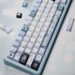 Handcrafted Plum Blossom Frost Keycaps, showcasing serene red blossoms and frosty accents on a dark PBT canvas, reflecting traditional Chinese artistry.