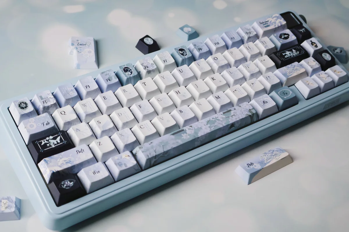 Handcrafted Plum Blossom Frost PBT keycaps, captured from a unique angle, reveal serene traditional Chinese artistry and frosty details on an elegant dark.