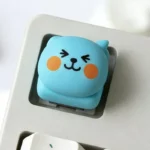 Qoo Expression Keycaps gallery showcasing playful character ESC keycaps. Vibrant, expressive cartoon designs from multiple angles, perfect for keyboard personality.