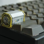 Detailed views of the handcrafted Radioactive Scrap Box keycap, showcasing its gritty, post-apocalyptic resin barrel design from multiple angles。