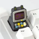 A meticulously Retro Desktop Computer Artisan Keycaps for the ESC key, revealing intricate miniature computer details and its captivating design.