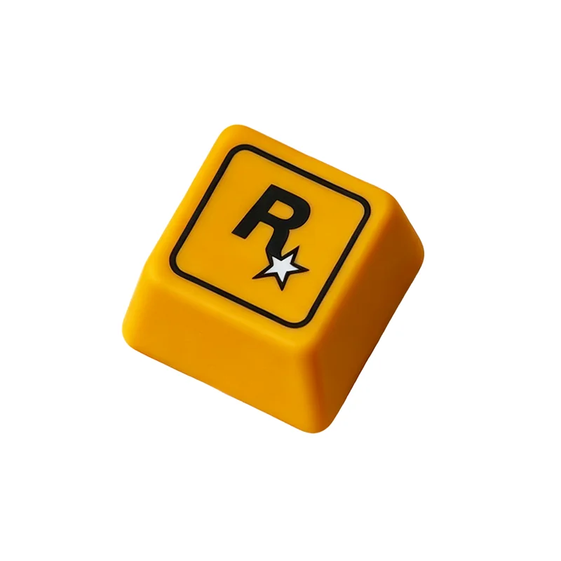 Close-up of the iconic Rockstar Games resin ESC keycap, showcasing its bold R* logo and sleek finish from a fresh gaming angle.