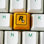 A vibrant close-up of the iconic Rockstar Games resin ESC keycap, highlighting its bold R* logo and sleek finish from a dynamic angle, perfect for cute keyboard.