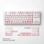 Detailed view of a Sakura Star Wish PBT keycap, with soft pink dye-sub blossoms and twinkling stars. Captures the set's dreamy elegance.