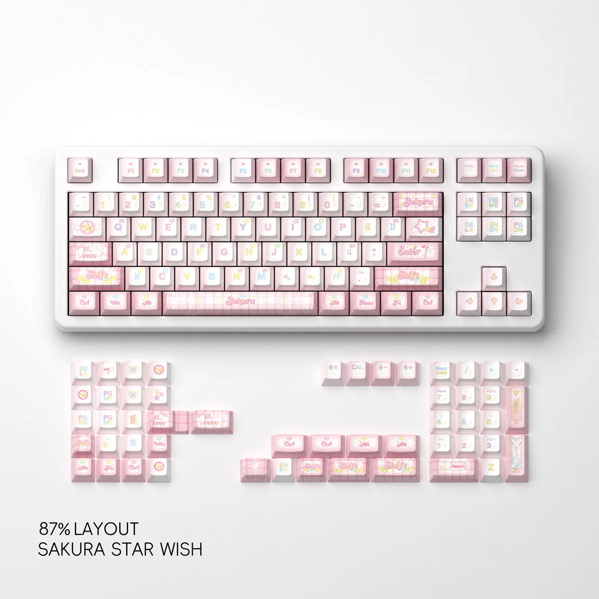 Detailed view of a Sakura Star Wish PBT keycap, with soft pink dye-sub blossoms and twinkling stars. Captures the set's dreamy elegance.