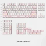 Dreamy PBT Sakura Star Wish keycap set showcasing soft pink flowers and twinkling stars. Dye-sublimated for vibrant, lasting elegance.