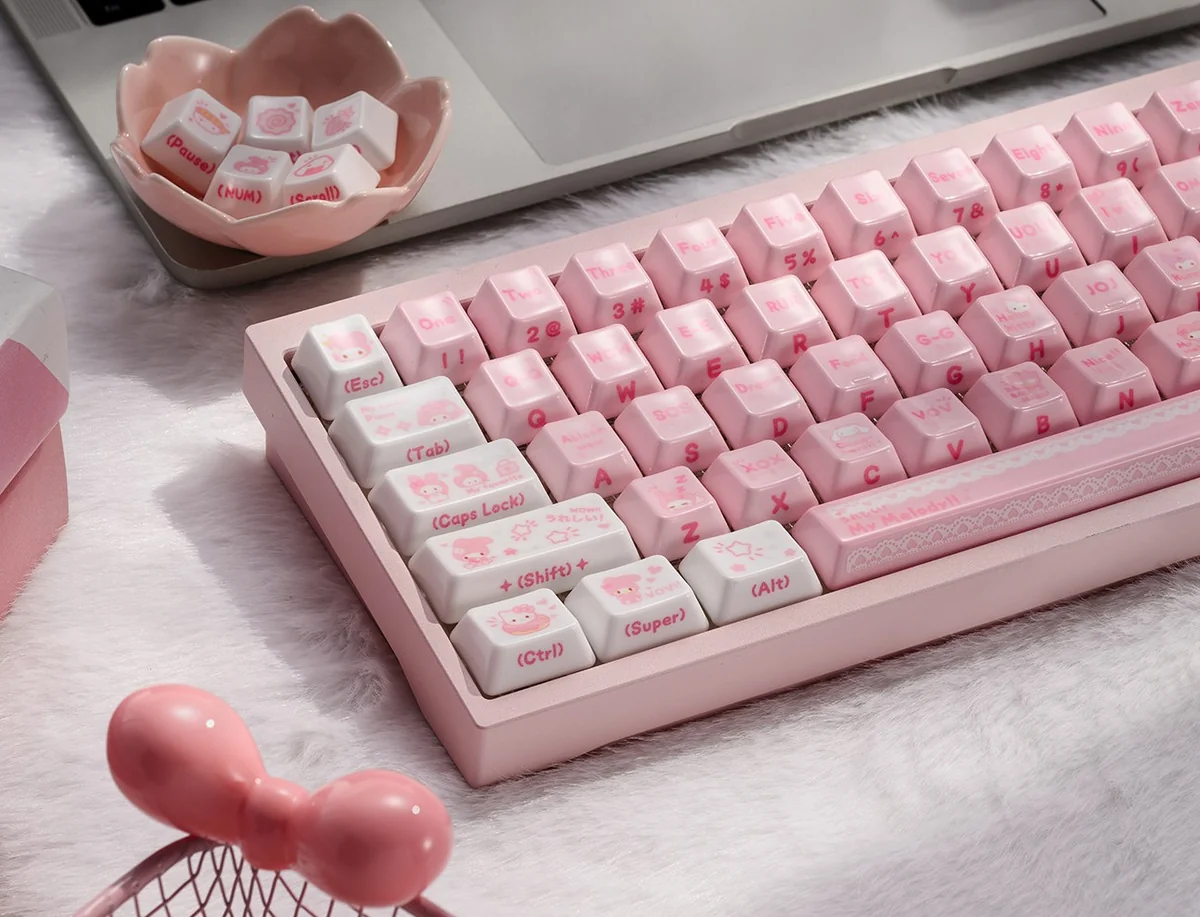 A collection of artisanal My Melody ceramic keycaps, showcasing their smooth texture and adorable pastel designs from various charming angles.