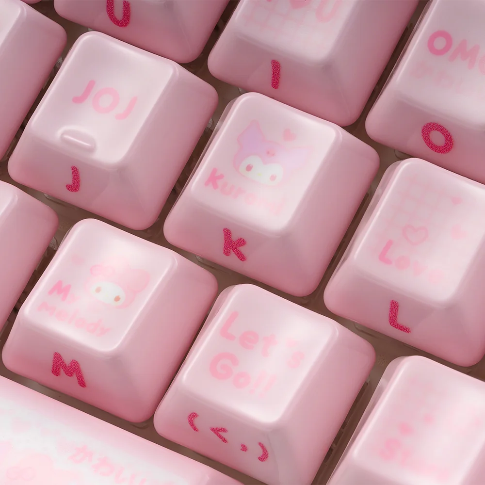 Artisanal My Melody ceramic keycaps showcasing whimsical pastel designs and smooth texture from various angles, highlighting their unique charm.