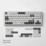 Angled view of the Save Point Cherry Keycap Set, with durable dye-sublimated pixel art. Highlights vintage computing aesthetic.