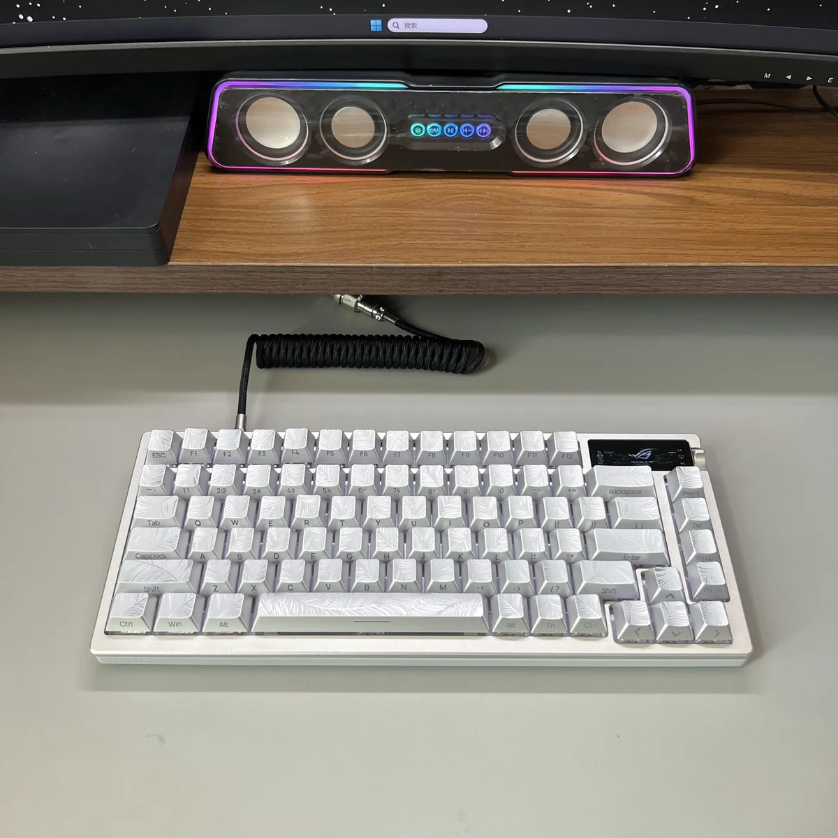 Ethereal Silver Feather Keycaps from a distinct angle, showcasing the luminous side-engraved legends and the sleek metallic.