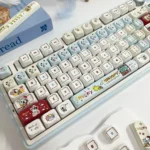 Whimsical Snoopy PBT MOA keycap set, showcasing vibrant dye-sub Peanuts characters from a unique angle. Details the exclusive Snoopy keycaps for nostalgic touch.
