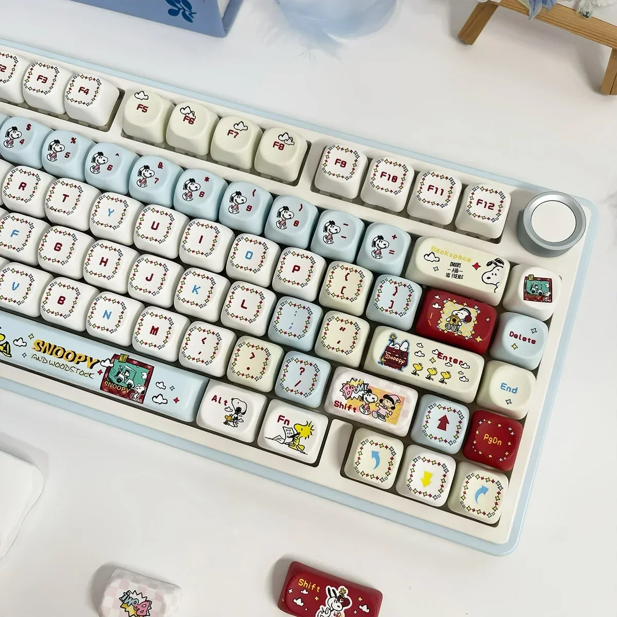 Whimsical Snoopy PBT MOA keycap set showcasing exclusive dye-sub Peanuts characters and vibrant, nostalgic details for a playful desk.