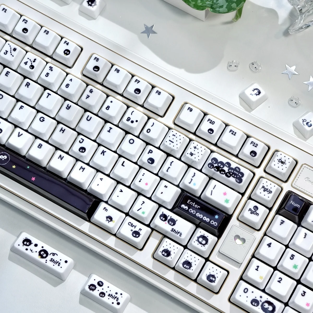Intricate handcrafted details of the Ghibli Nostalgia Artisan Susuwatari Keycap, showcasing its whimsical black and white finish.