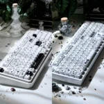 Close-up of a whimsical, handcrafted Susuwatari keycap, showcasing its unique texture and artistic black and white design.