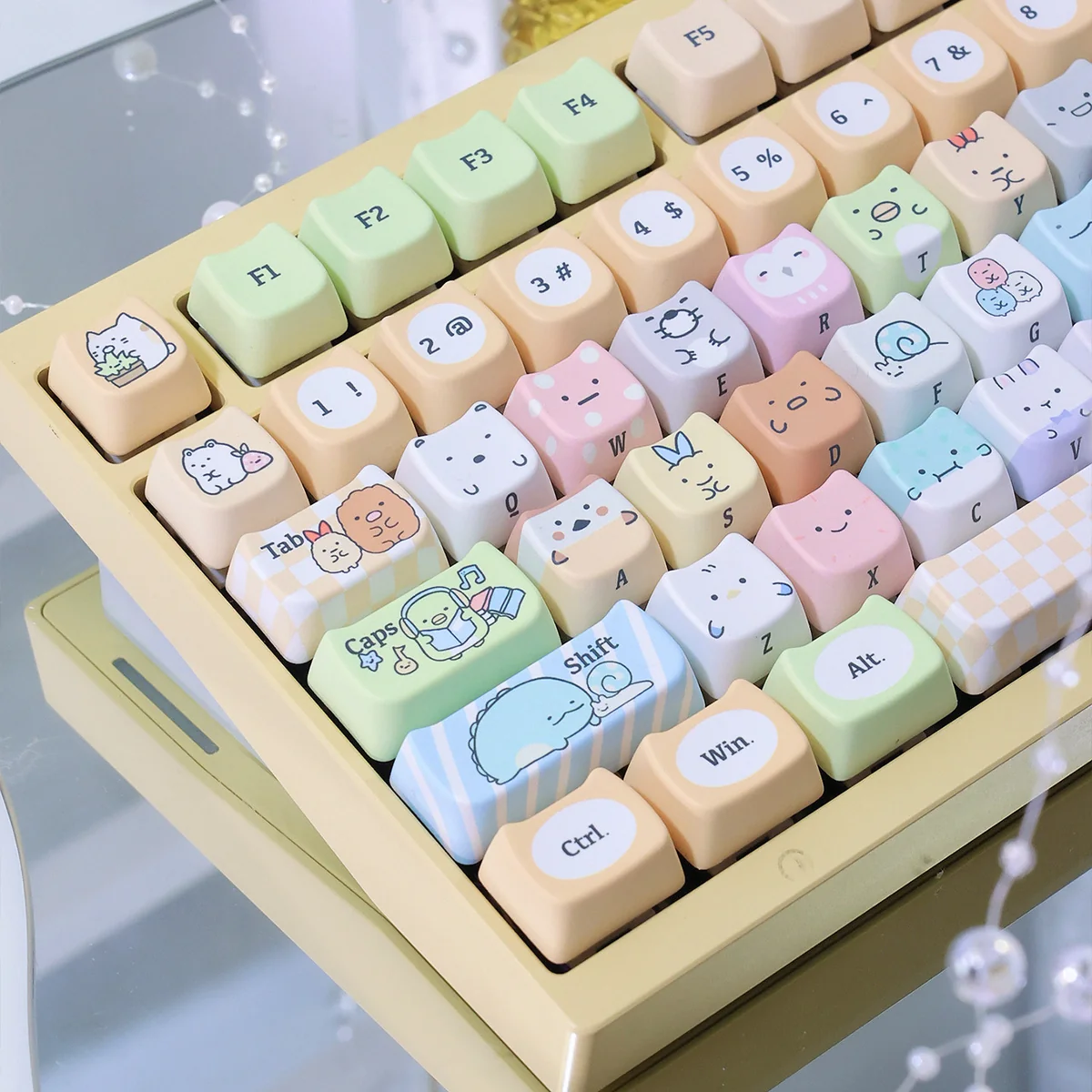 Adorable Sumikko Gurashi cat PBT keycap, showcasing its vibrant dye-sub character design and durable quality from a playful, detailed angle.