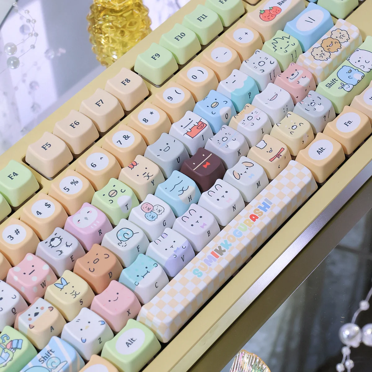 Adorable Sumikko Gurashi cat PBT keycap, showing its charming, vibrant dye-sub design from various angles. Playful and durable.