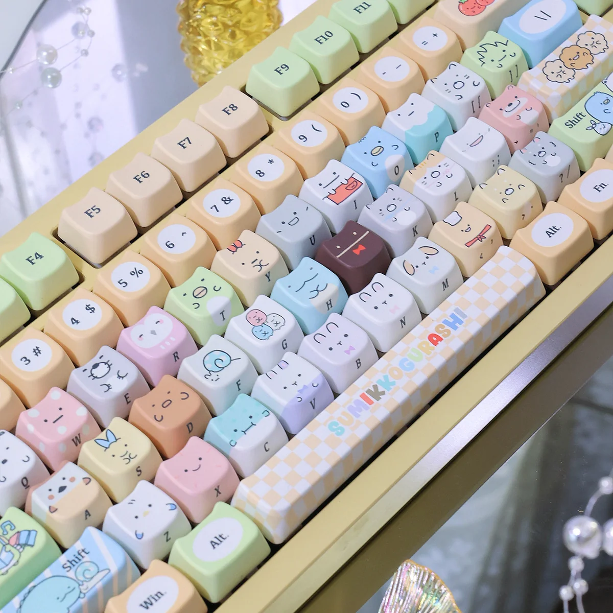 Adorable Sumikko Gurashi cat PBT keycap, vibrantly showcasing its charming character design and durable dye-sub colors from a delightful angle.