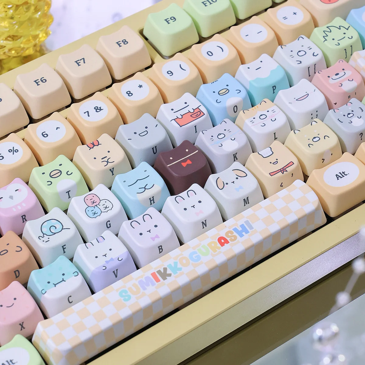Detailed shot of the adorable Sumikko Gurashi cat PBT keycap, showcasing its vibrant dye-sub colors and durable texture from a side view.