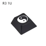 Detailed view of a single R4 height Taiji PBT keycap, featuring a deeply laser-engraved Yin Yang design, ideal as an artisan accent key.