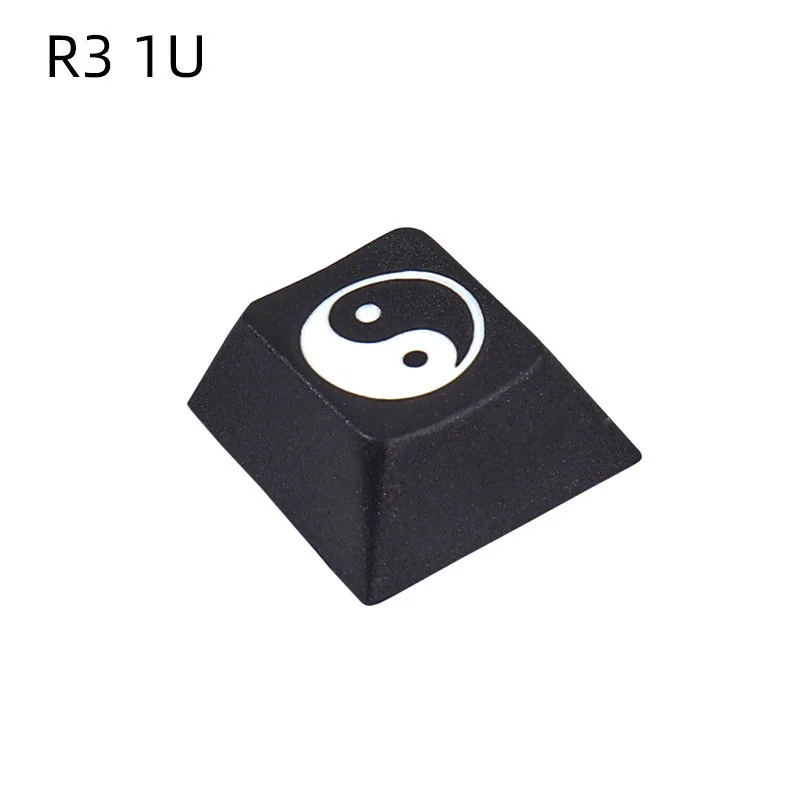 Detailed view of a single R4 height Taiji PBT keycap, featuring a deeply laser-engraved Yin Yang design, ideal as an artisan accent key.