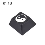 Single R2 Taiji PBT keycap, deeply laser engraved with a harmonious Yin Yang symbol, showcasing artisan craftsmanship.