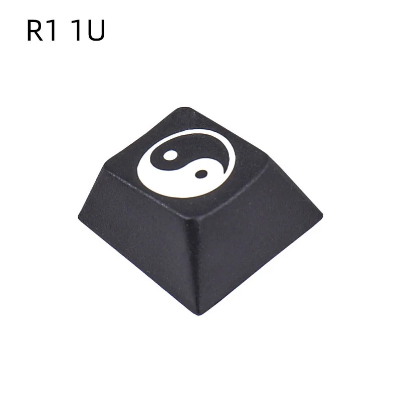 Single R2 Taiji PBT keycap, deeply laser engraved with a harmonious Yin Yang symbol, showcasing artisan craftsmanship.