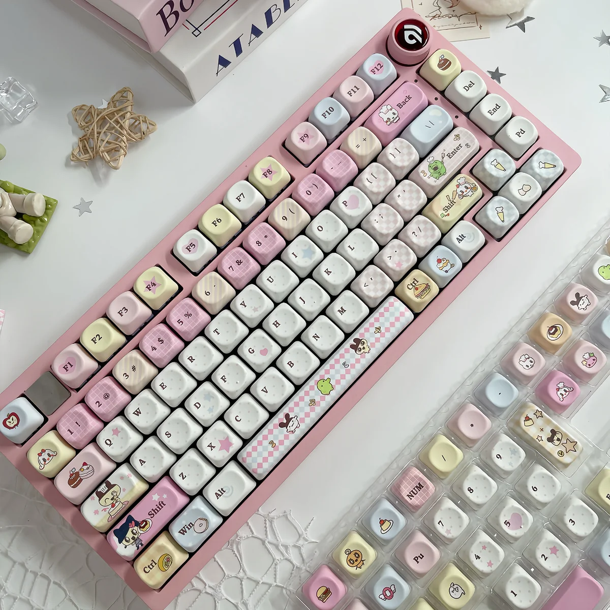 Nostalgic Tamagotchi PBT dye-sub keycaps set. Vibrant, pixelated retro-tech characters displayed from multiple angles, highlighting playful designs.