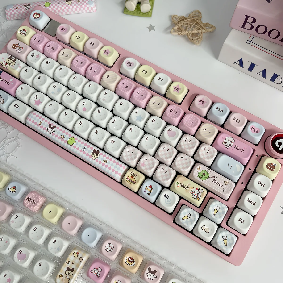 A close-up view of the vibrant, pixelated Tamagotchi PBT keycaps set, showcasing playful retro-tech designs and durable dye-sub legends for mechanical keyboard.