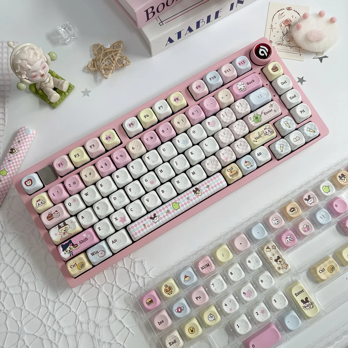 Nostalgic Tamagotchi PBT dye-sub keycaps set, vibrantly displaying playful pixelated characters with a retro-tech aesthetic in MOA profile.
