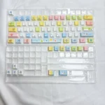 A collection of vibrant Tamagotchi Keycaps, showcasing pixelated retro digital pet designs on durable PBT from various playful angles.