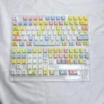 Vibrant 73-key Tamagotchi PBT keycap set, featuring retro pixelated digital pet designs for a cheerful, nostalgic desk setup.