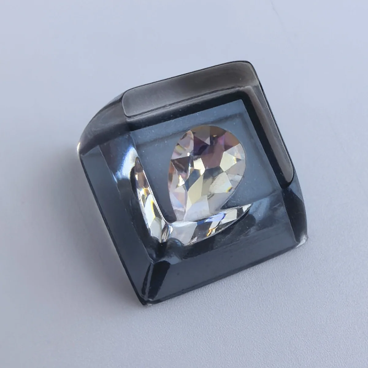 Delta Force Heart of Africa handcrafted resin keycap gallery. Unique translucent epoxy ocean heart design in deep black and pure white, showcasing intricate design.