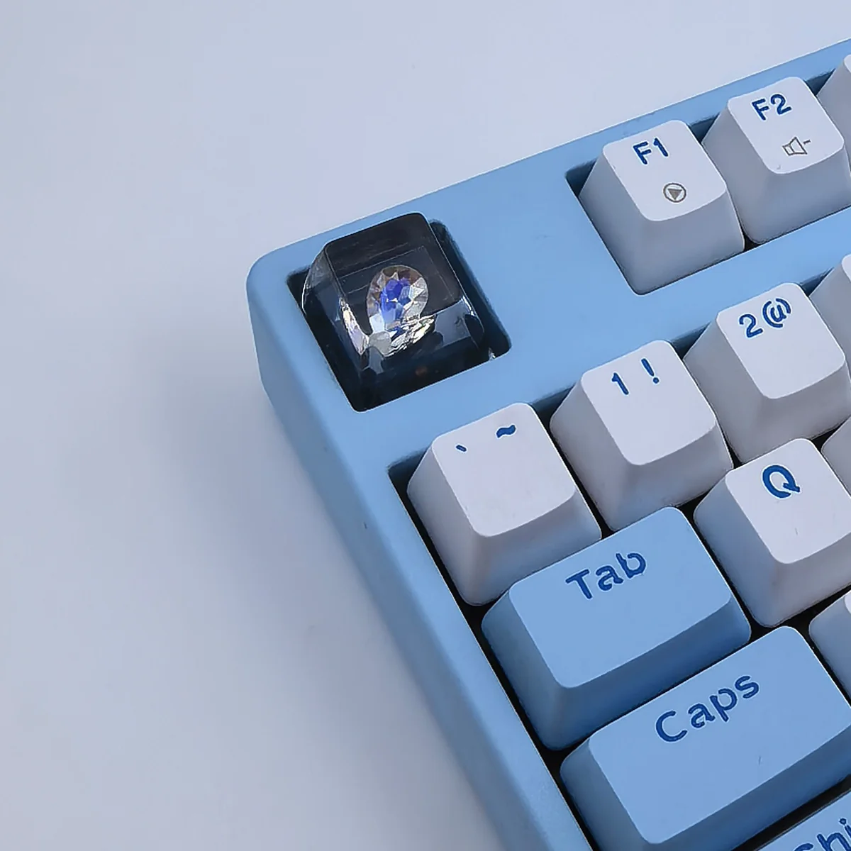 Delta Force Heart of Africa handcrafted resin keycap gallery, highlighting its unique translucent epoxy design with deep black and pure white swirls.