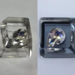 A unique handcrafted Delta Force Heart of Africa resin keycap, featuring translucent epoxy with deep black and pure white swirls, capturing an artistic design.
